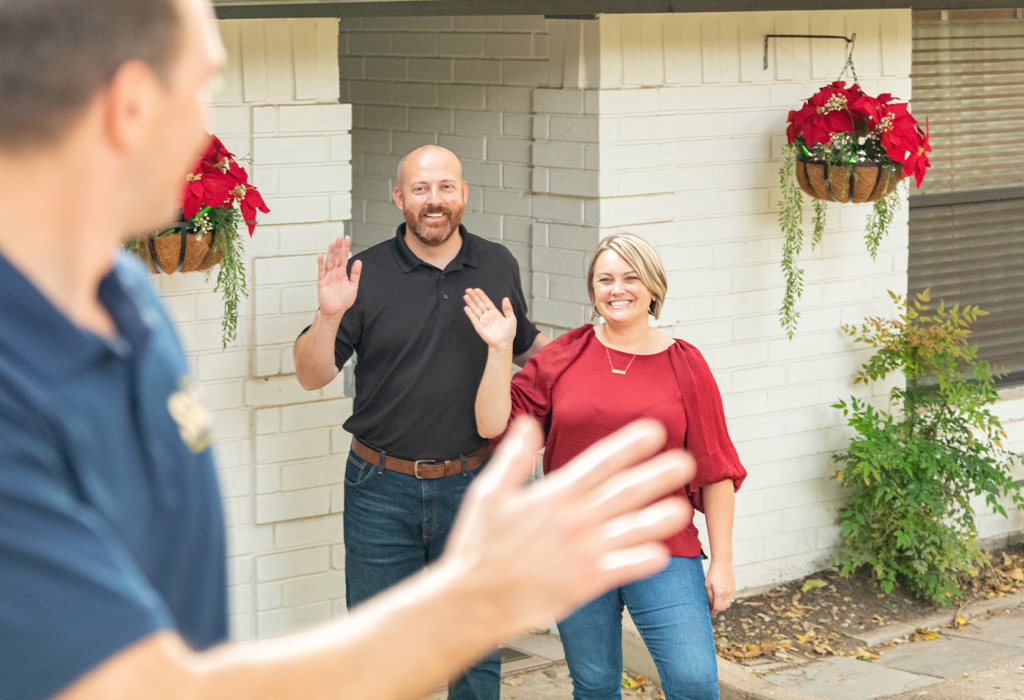 Happy homeowners representing satisfied HVAC, electrical, and plumbing service customers.