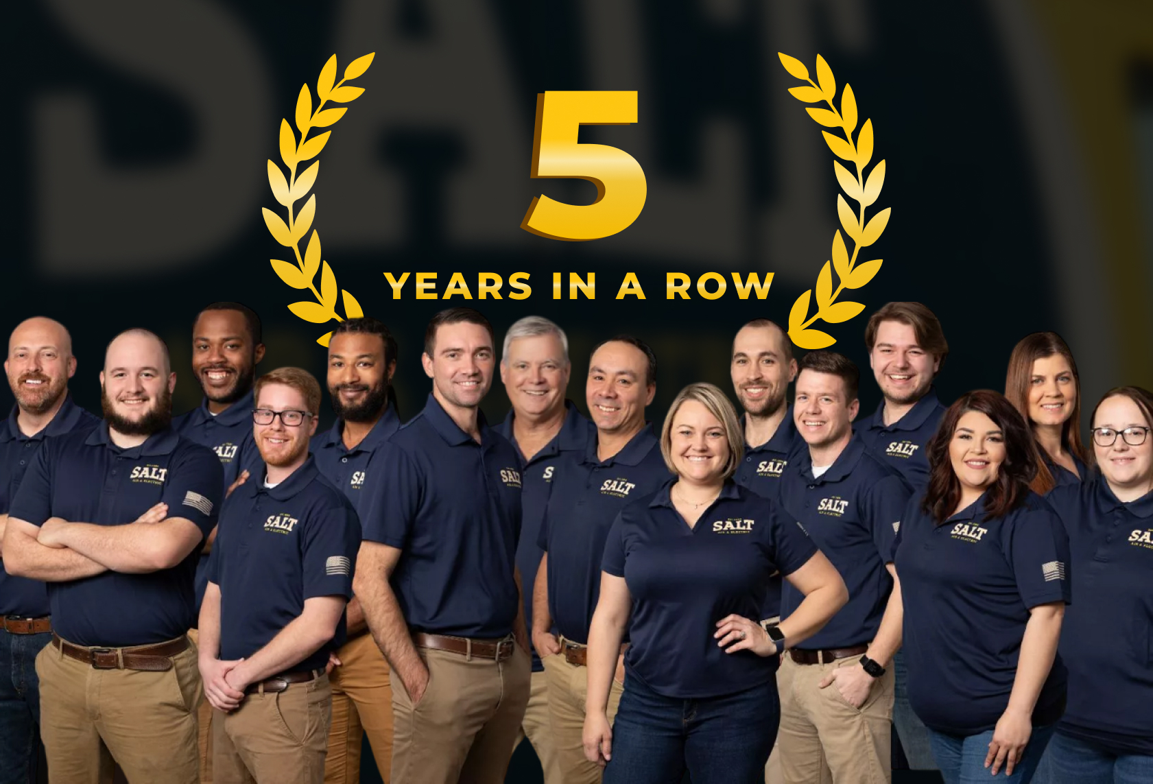 Salt Service Co. professional team standing in front of company branding with multiple Best of Austin winner badges displayed
