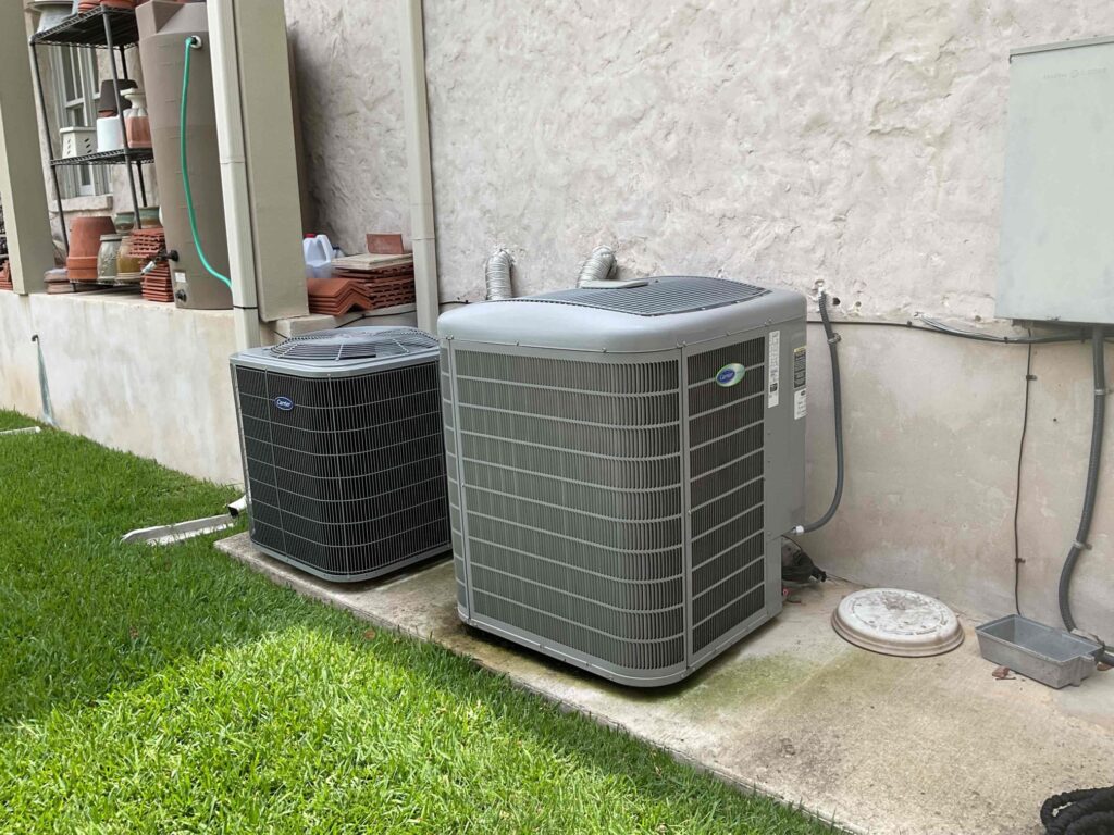 Two newly installed HVAC units outside a home